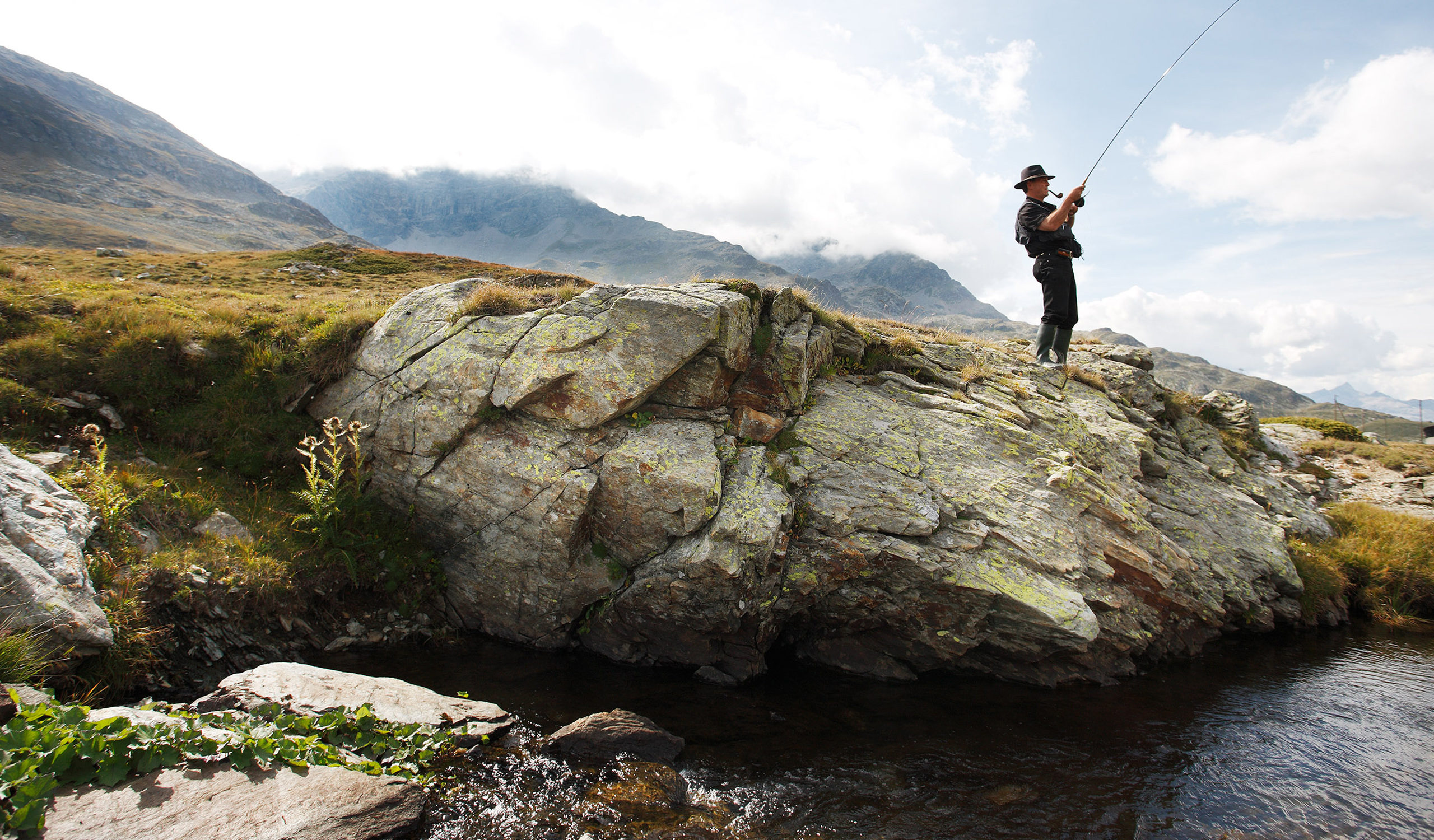 Fly fishing photography taken in the Engadine, Switzerland by photographer Justin Hession. Switzerland has some amazing rivers carving through the alps which makes for some of the most scenic picturesque fishing locations in the world.