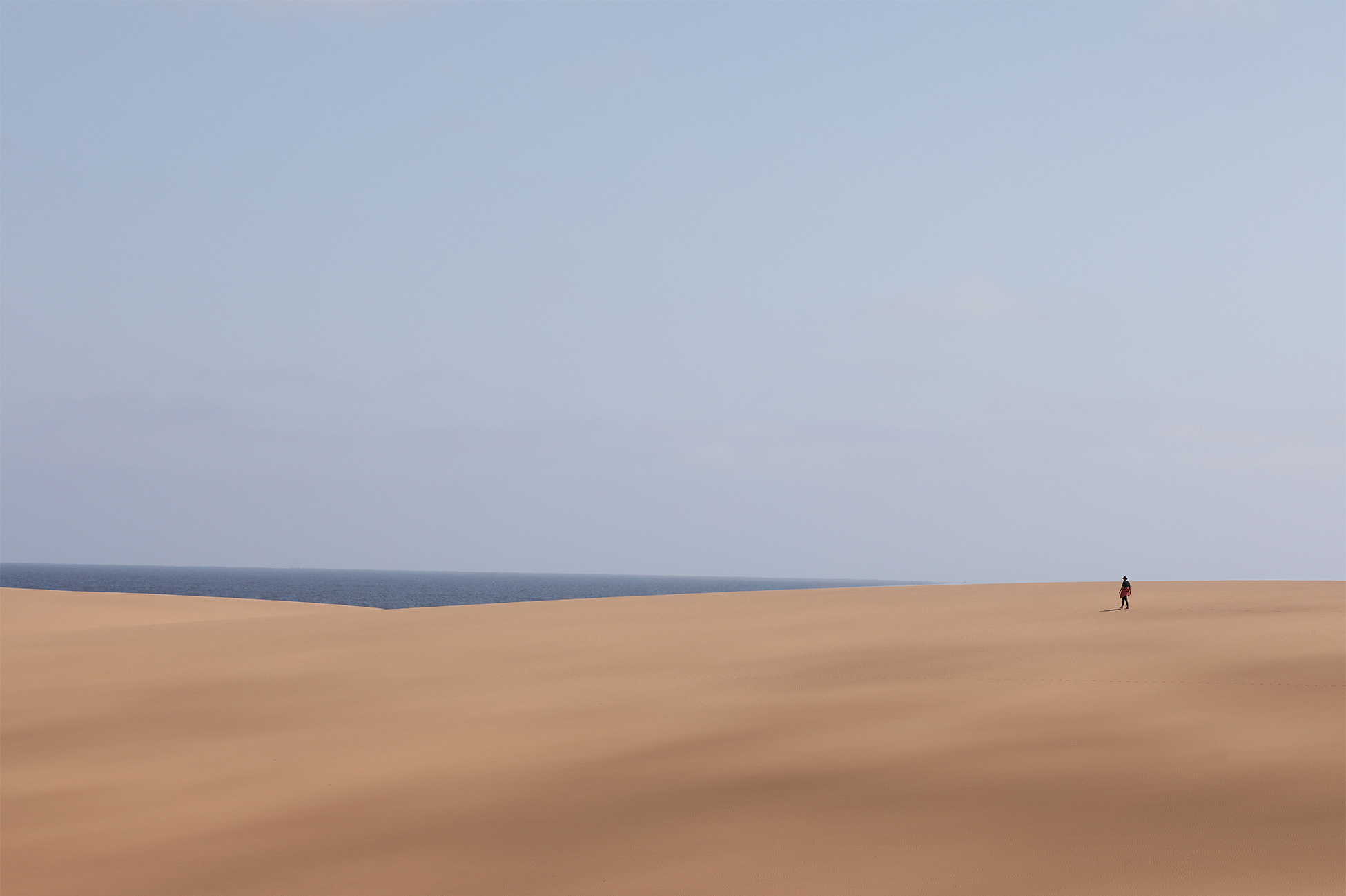 The desert in southern Angola is called the Moçâmedes Desert, forming the northern extension of the ancient Namib Desert. Located in Namibe Province, this dry coastal region is characterized by striking sand dunes, gravel plains, and unique plant life such as Welwitschia mirabilis, stretching from the Atlantic coast into the arid interior.