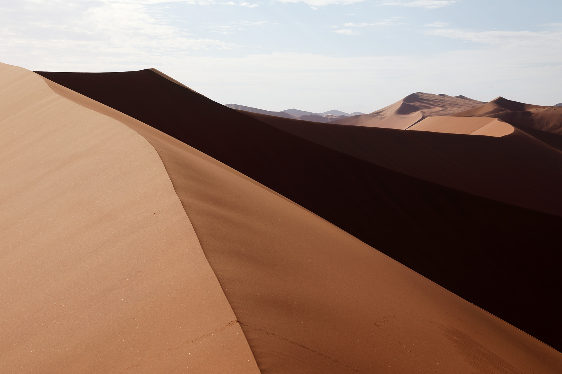 The sand dunes in the Namib are dynamic and change shape with the wind. The dunes around the Sossusvlei area are known as “star dunes” due to the wind shaping them from all directions.