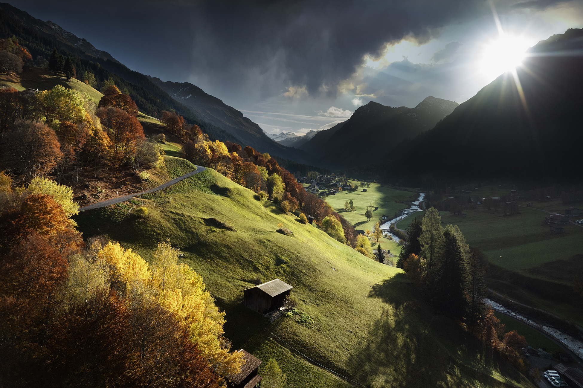 Autumn light falling on the valleys of Switzerland turning the trees a beautiful yellow/red color