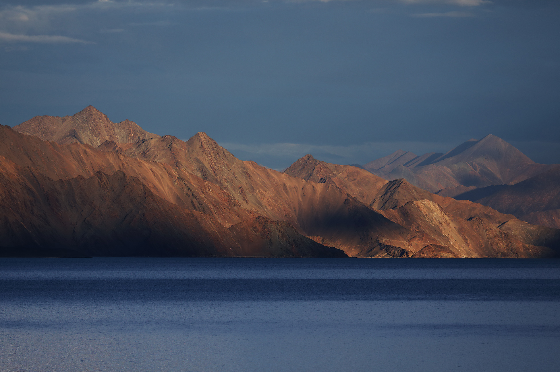 Epic motorbike journey through the rugged high-altitude passes of Ladakh, India.