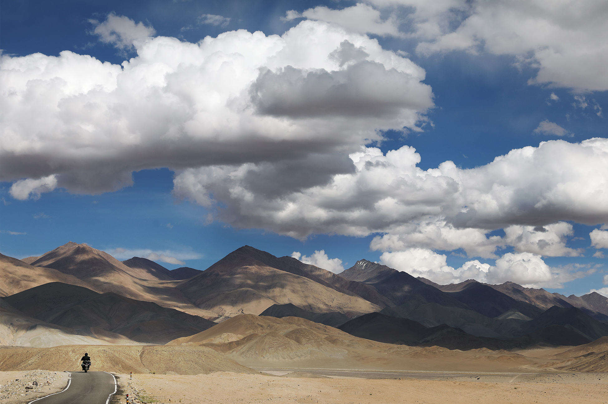 Epic motorbike journey through the rugged high-altitude passes of Ladakh, India.