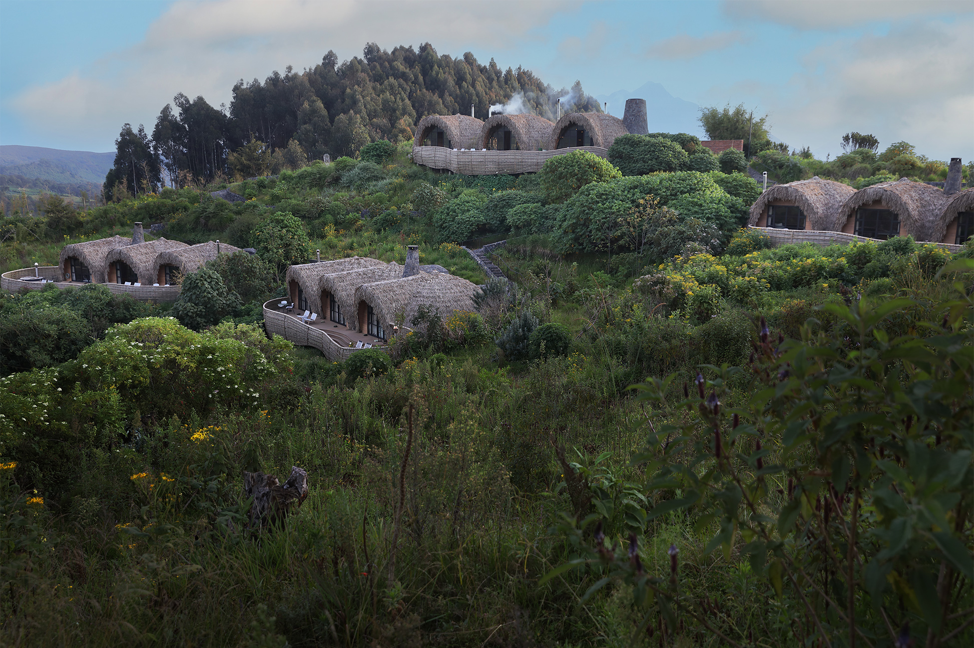 Luxury villa at Wilderness Bisate Reserve overlooking Volcanoes National Park, gateway to Rwanda mountain gorilla trekking.