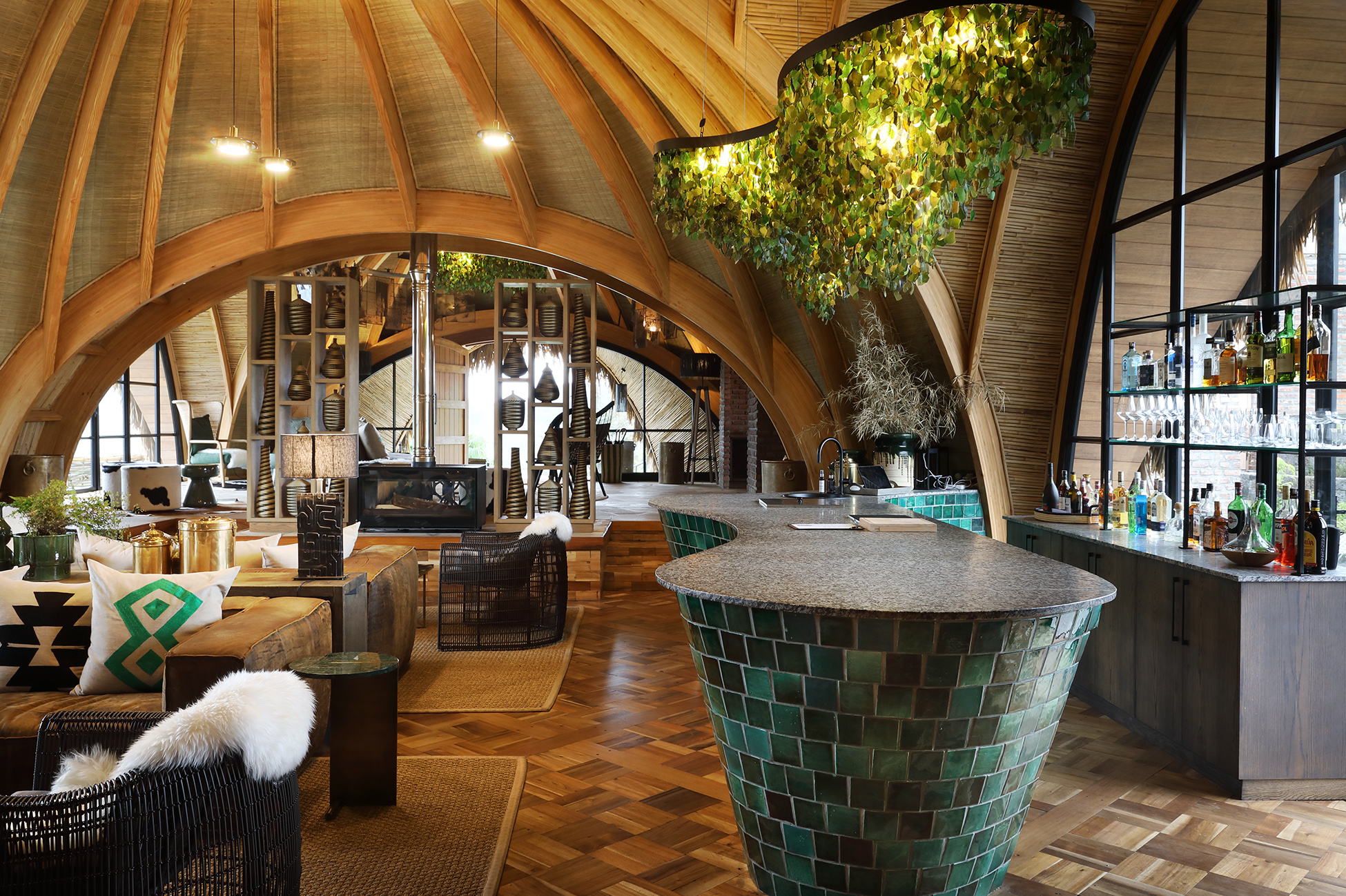 Guests at Wilderness Bisate Reserve enjoy luxury eco-lodges near Volcanoes National Park, home to Rwanda’s endangered mountain gorillas.