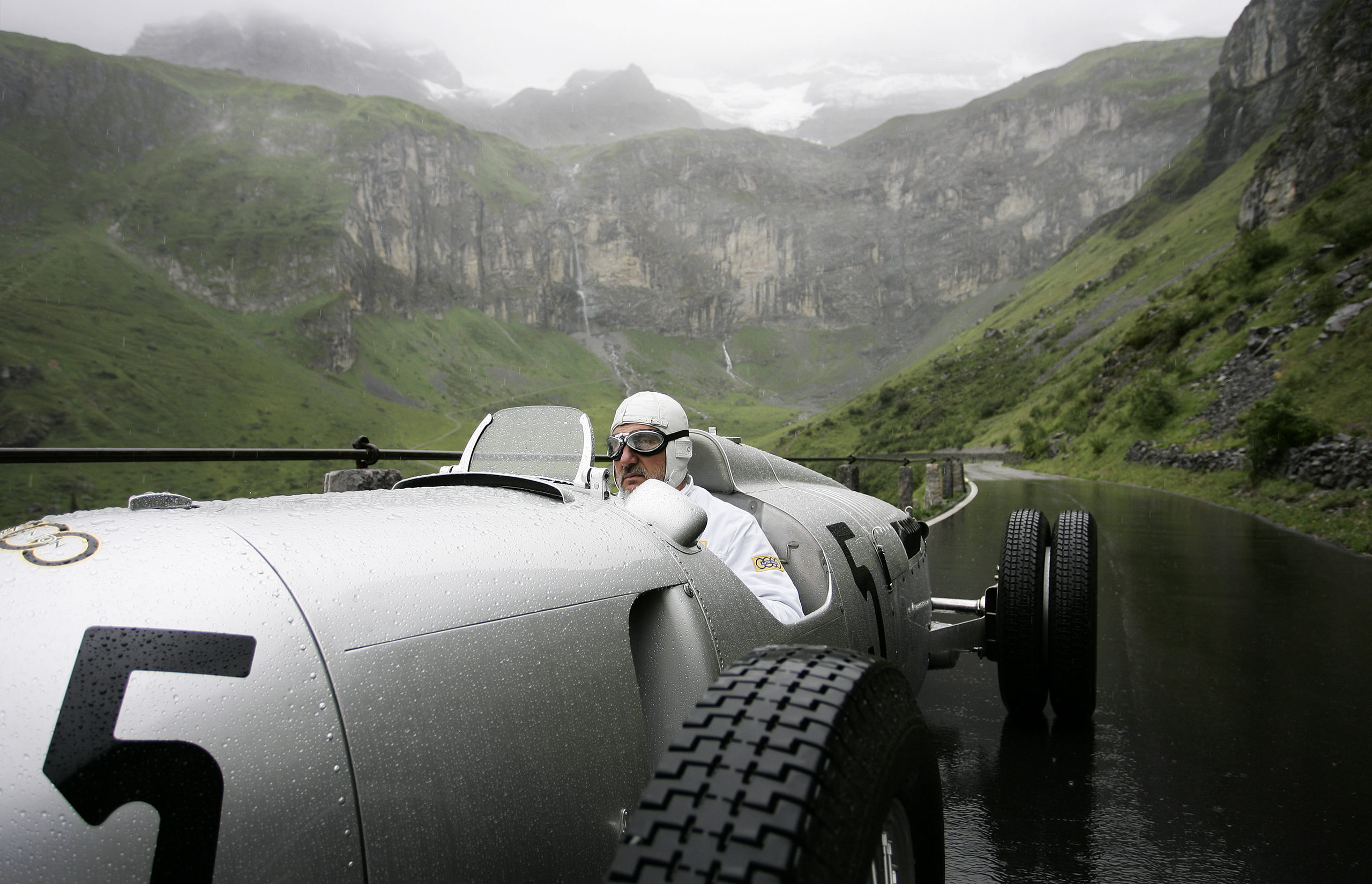 Zurich photographer Justin Hession Photography Portrait photographer and Travel photographer photographing Classic 1937 Auto Union C-type races the Klausen Pass, Switzerland. The best racers in the world came together every year from 1922 to 1934 to race the Klausen Pass. Past performances by historic racers include Caracciola, Stuck, Nuvolari, Chiron and many more memorable names at the Klausen.