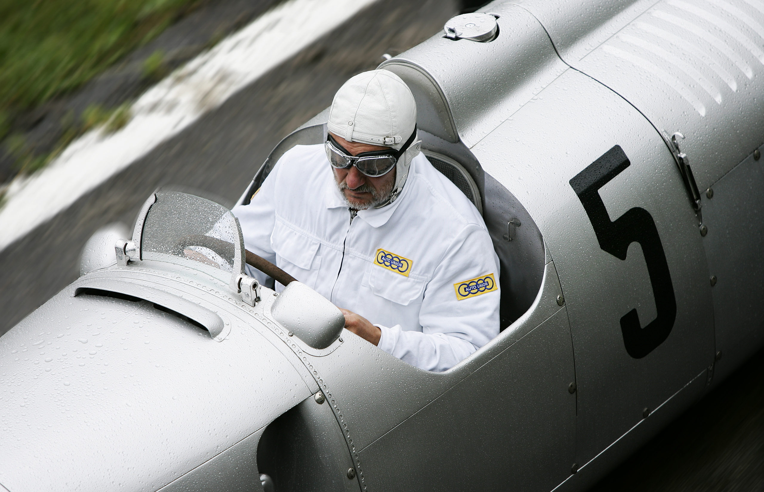 Zurich photographer Justin Hession Photography Portrait photographer and Travel photographer photographing Classic 1937 Auto Union C-type races the Klausen Pass, Switzerland. The best racers in the world came together every year from 1922 to 1934 to race the Klausen Pass. Past performances by historic racers include Caracciola, Stuck, Nuvolari, Chiron and many more memorable names at the Klausen.