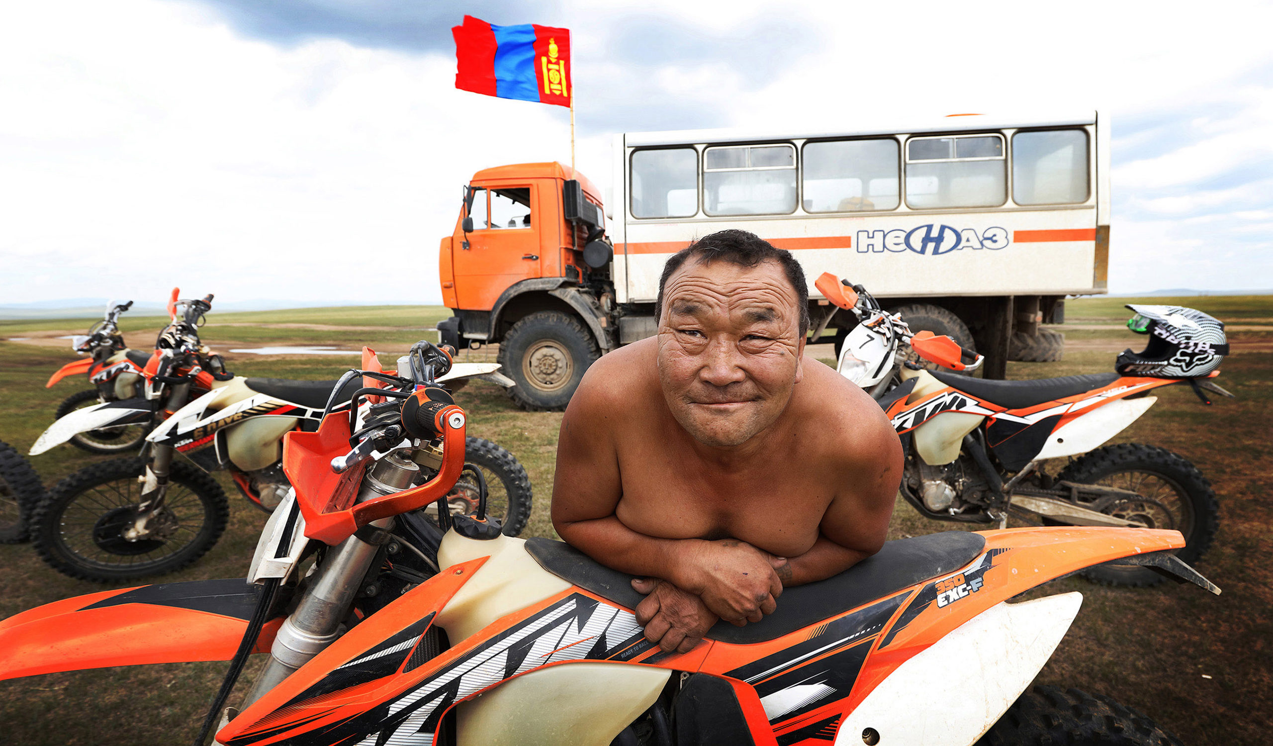 Riding KTM through Mongolia. There are no fences in Mongolia and one is free to ride wherever the adventure calls.
